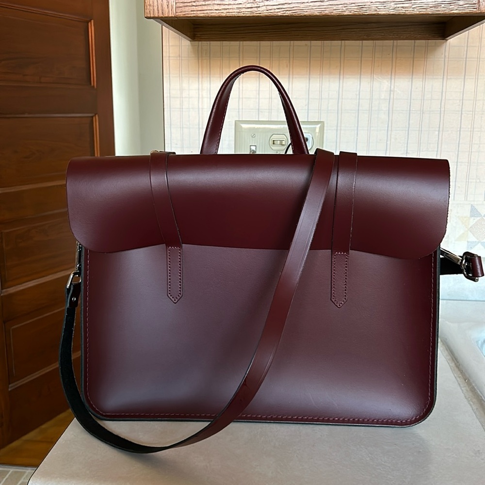 Cambridge satchel company. The music case-maroon/oxblood color. Brand new.